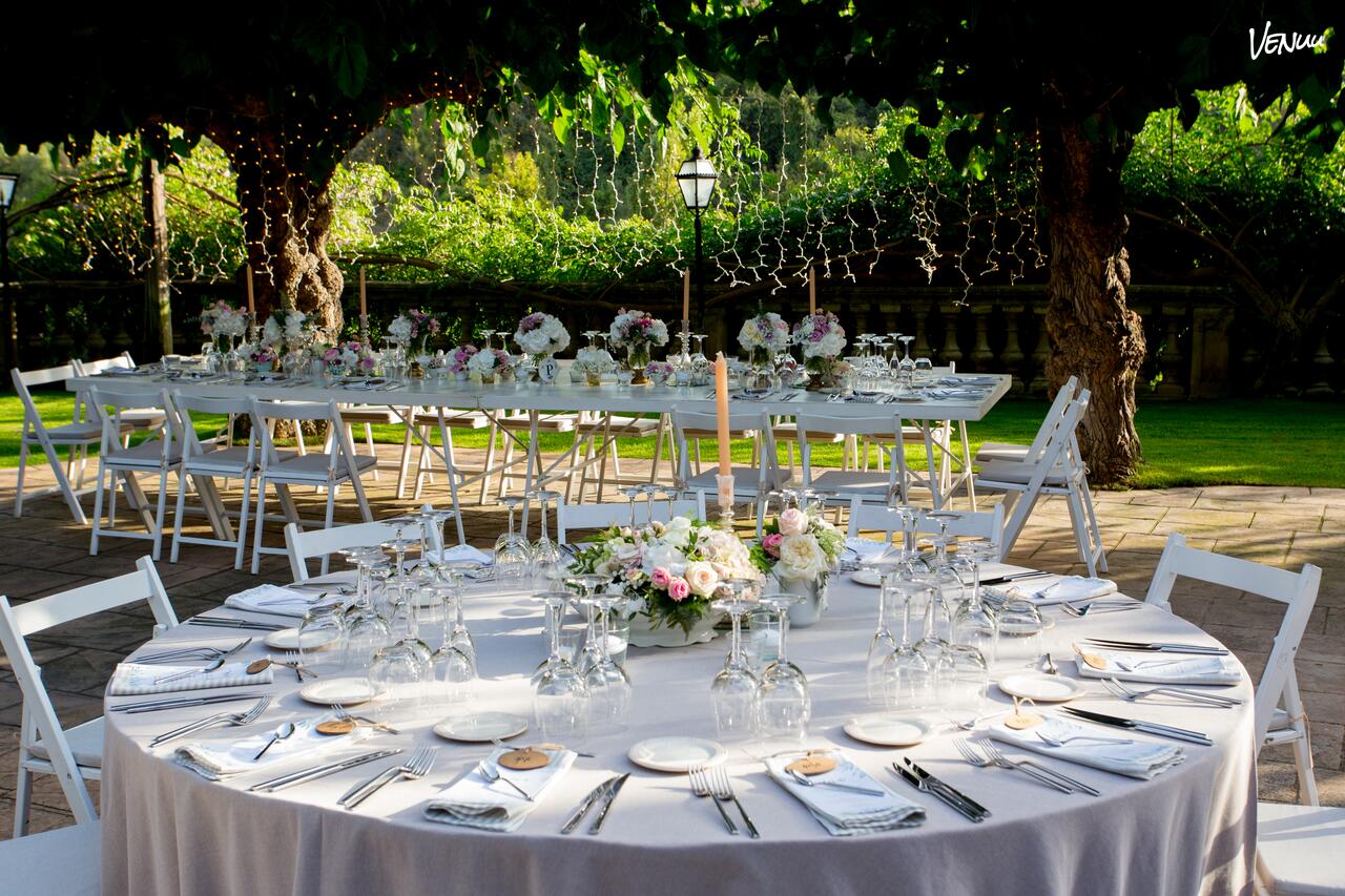 Rustic luxury masia wedding venue with elegant gardens near Barcelona.