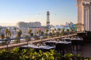 Rooftop overlooking Barcelona’s port for elegant sunset celebrations.