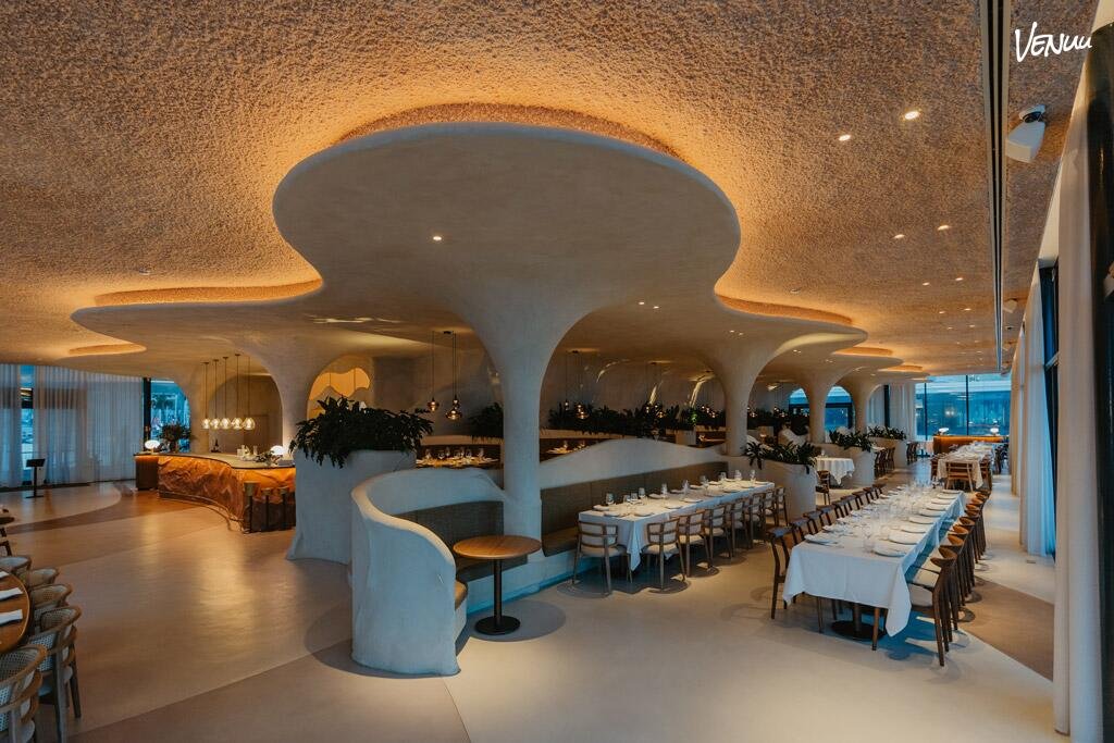Luxury restaurant in Barcelona with modernist architecture and sea views.